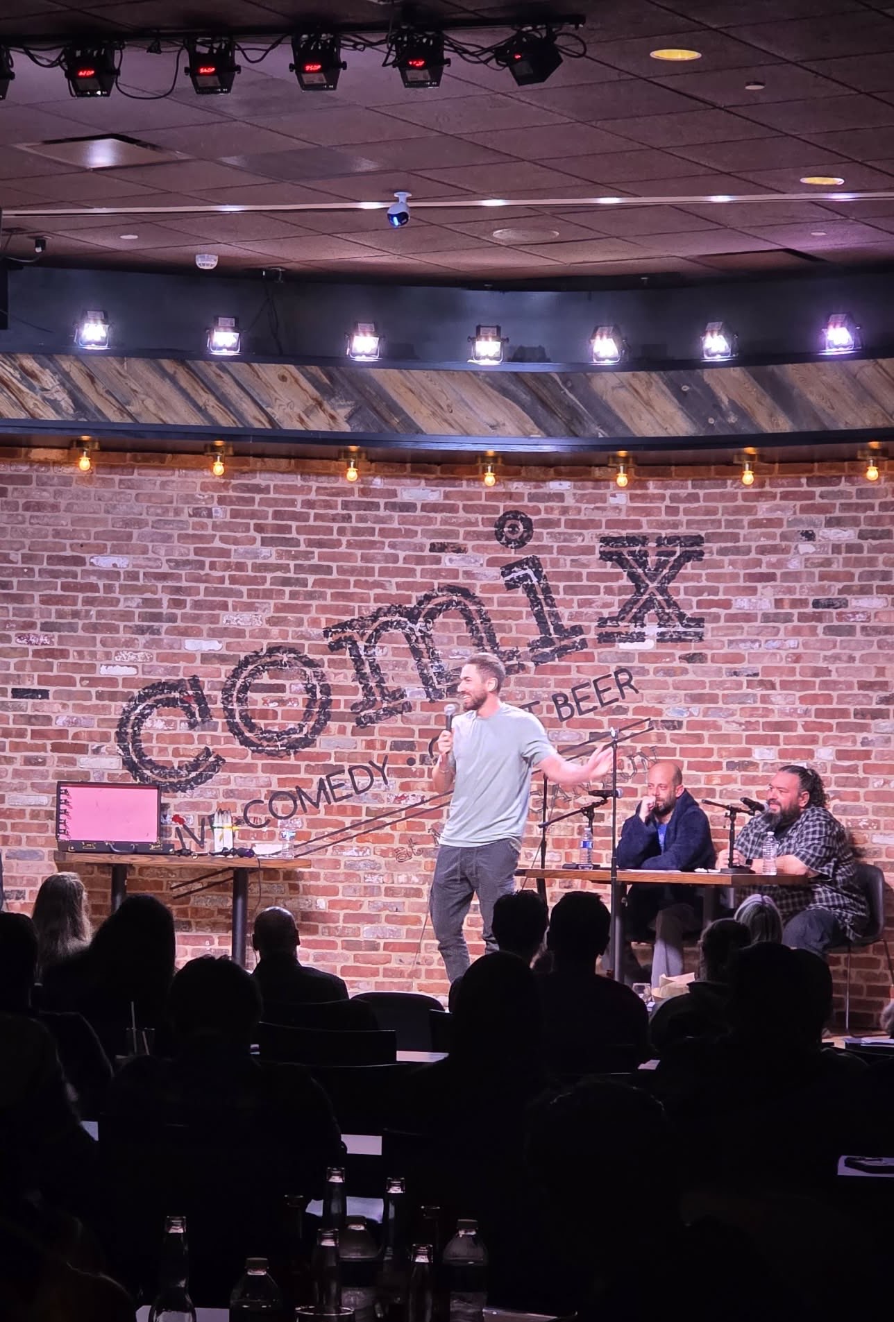 DiMaggio on stage at Comix Roadhouse with two other comics